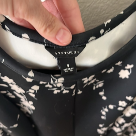 Short, pleated, form fitted at top, flared at the bottom. - Picture 2 of 6